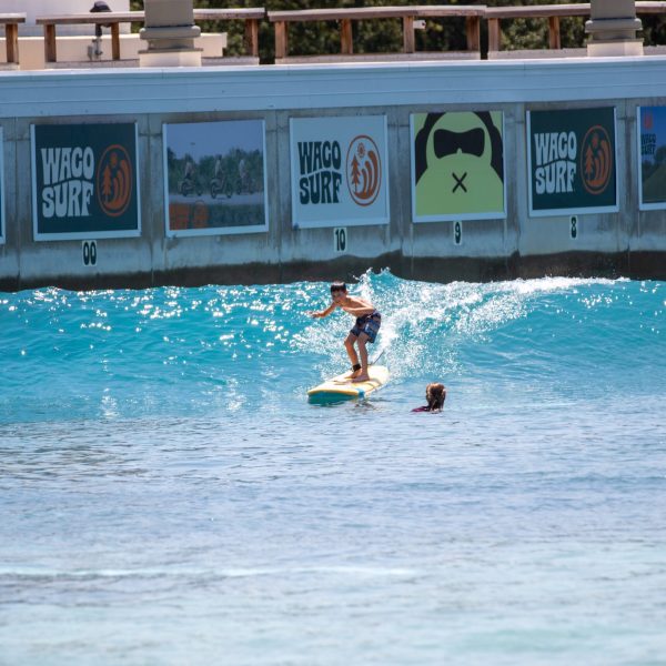 image of a teenager in a beginner surf sessions at waco surf a texas water park