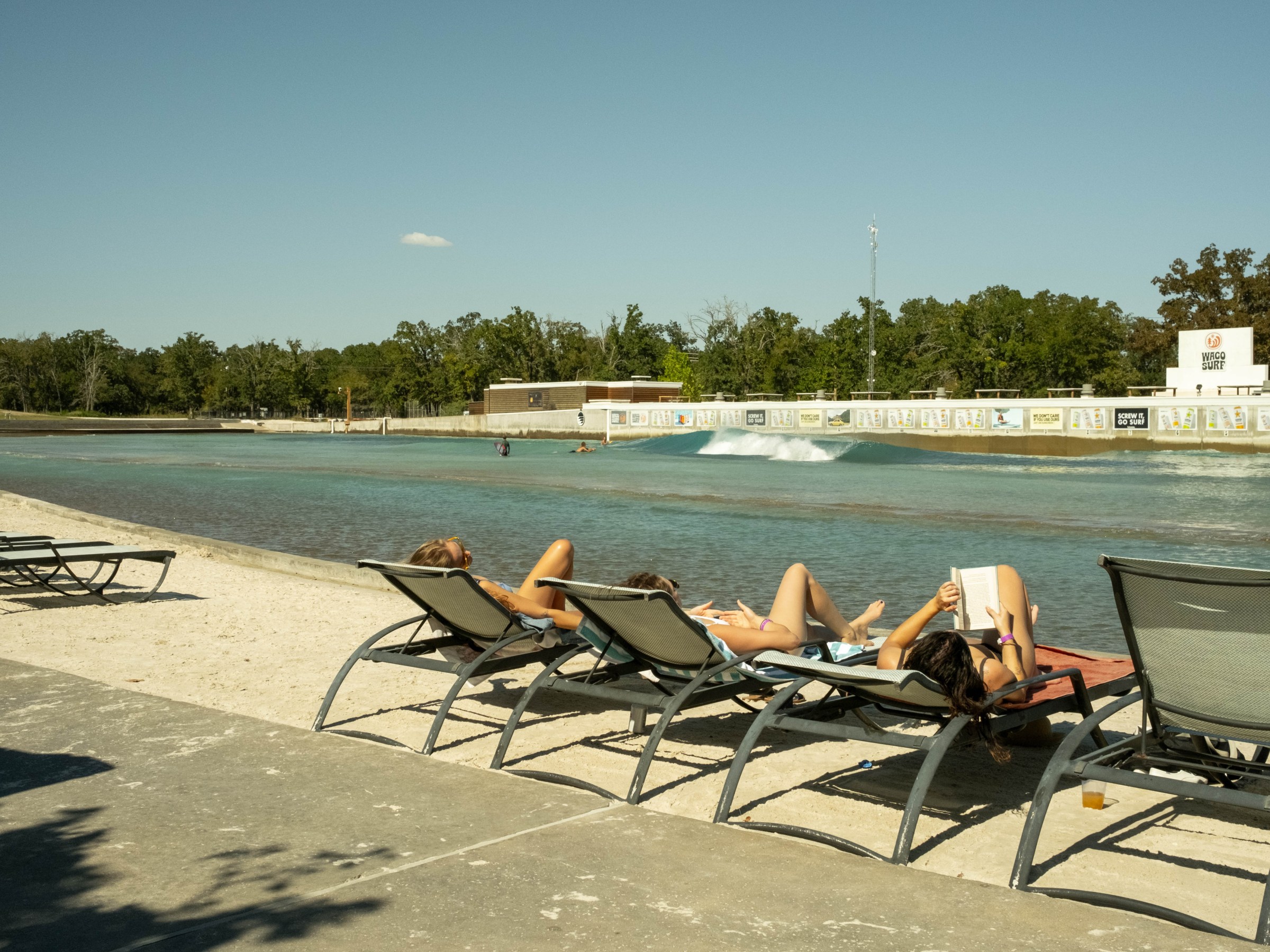People relaxing by the surf lagoon