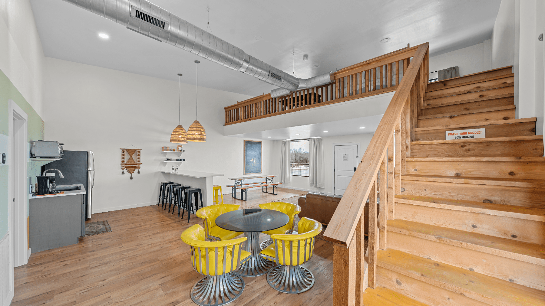 a kitchen area with wooden wheels in a room