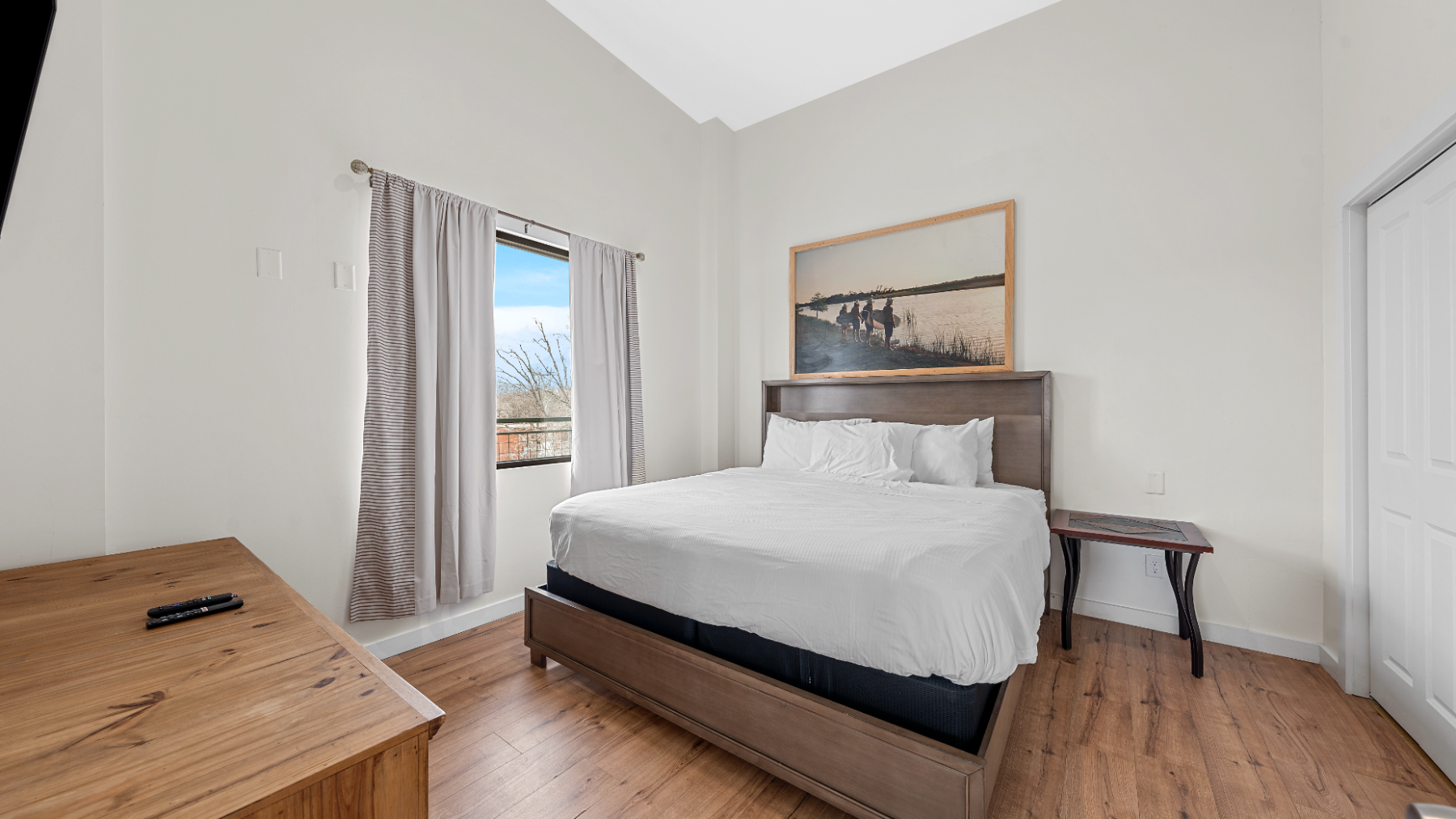 a bedroom with a bed in a room