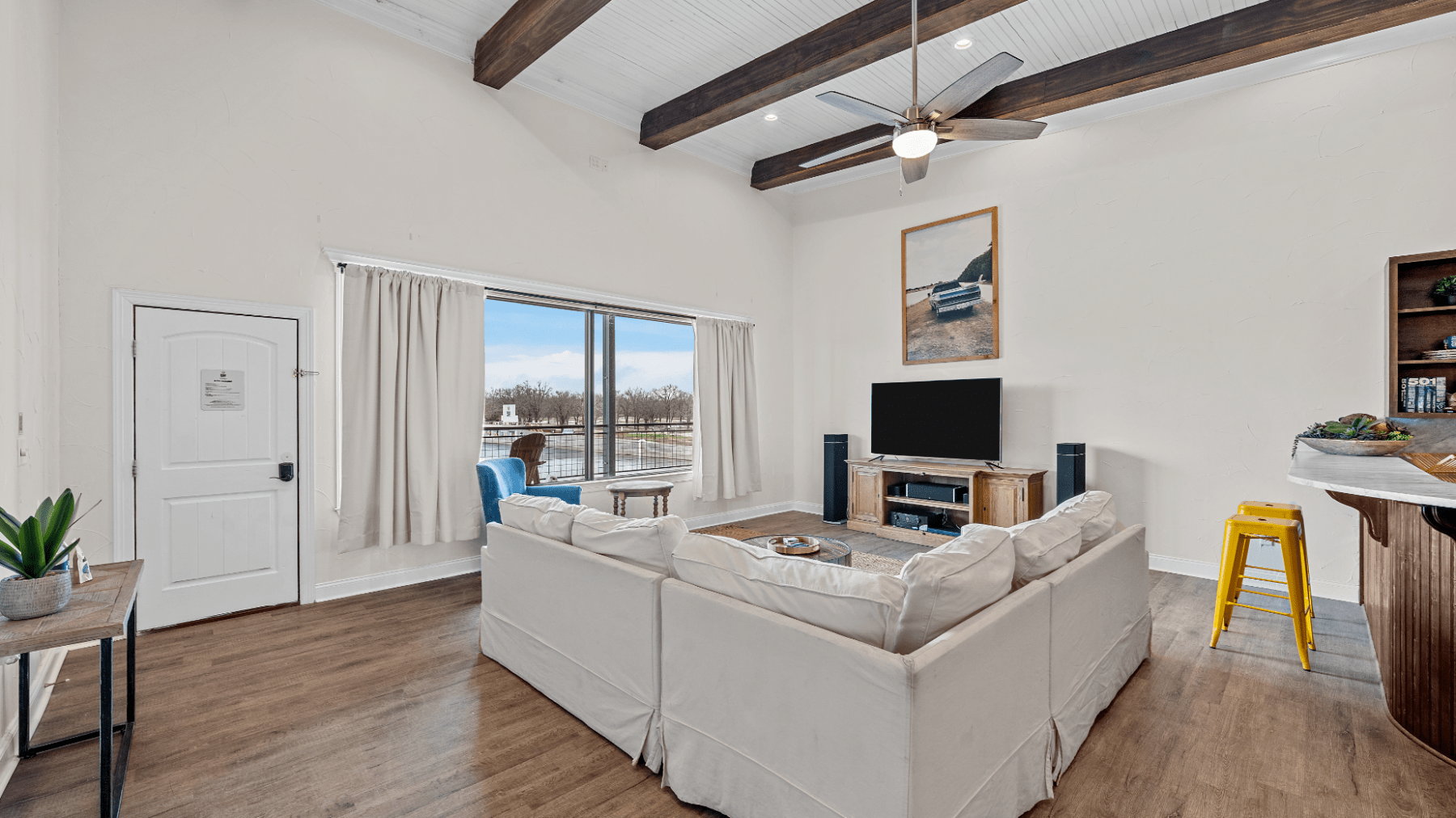 a room filled with furniture and a large window