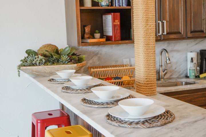 The Malibu Suite living kitchen and dining area, a lodging option at Waco Surf