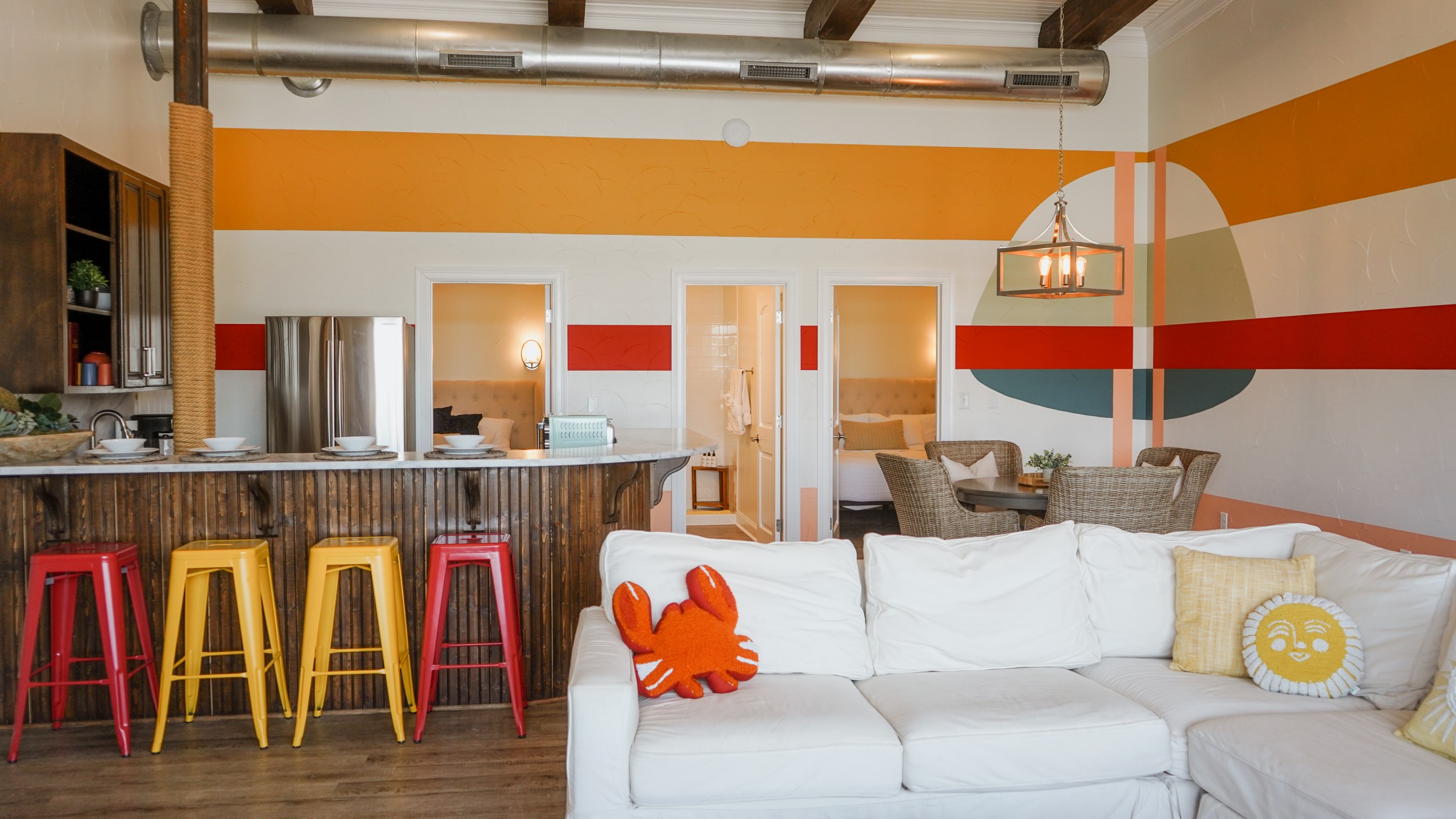 The Malibu Suite living room and kitchen, a lodging option at Waco Surf
