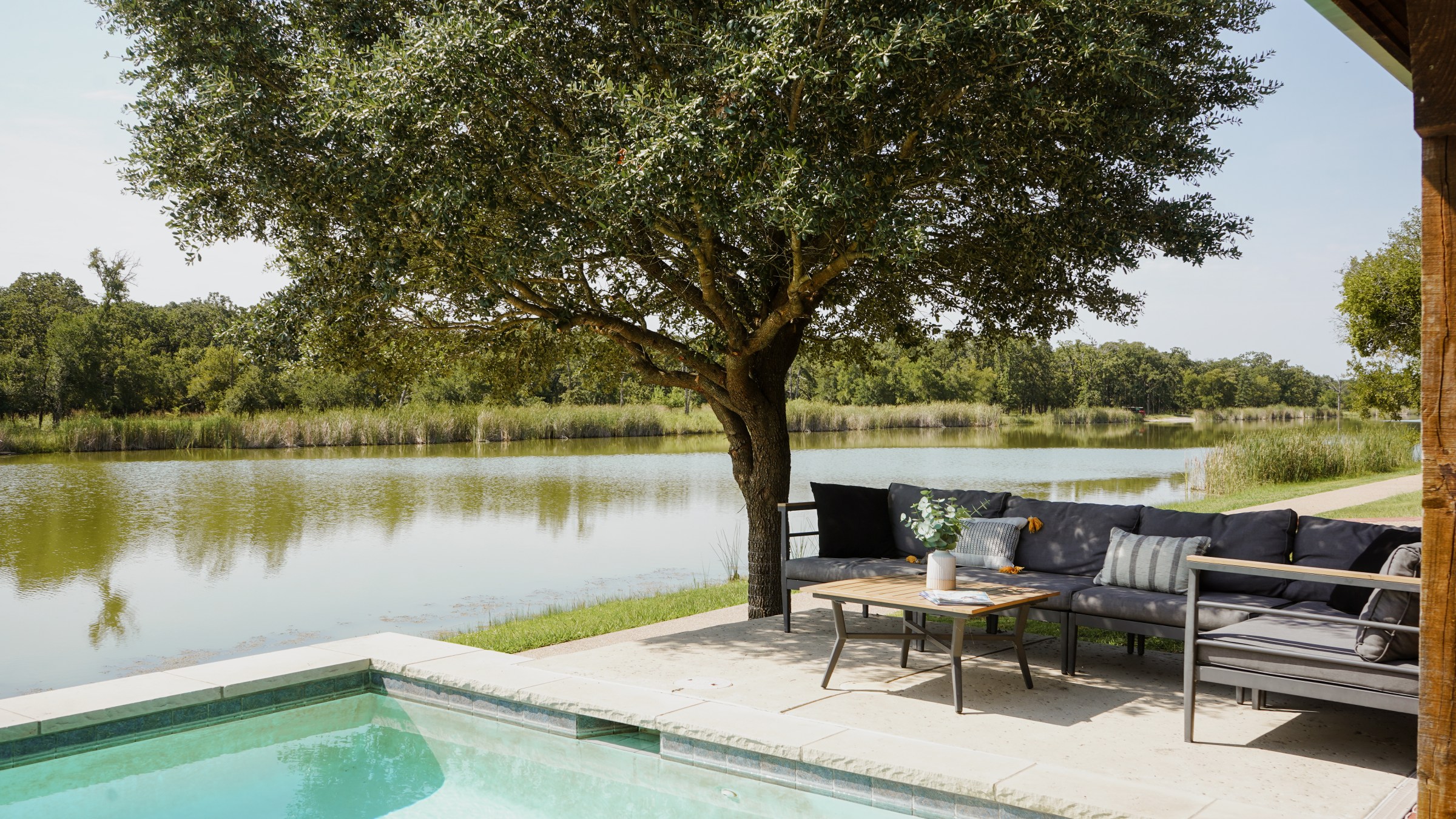 Pool and lounging area outside of The Lakehouse, a lodging option at Waco Surf