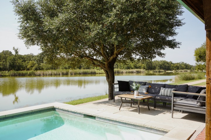 Pool and lounging area outside of The Lakehouse, a lodging option at Waco Surf