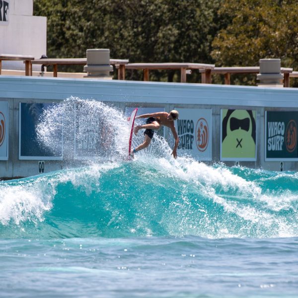 image of a surfer taking the pro surf session at waco surf a texas water park